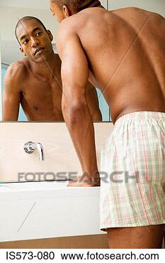 Stock Photography - man looking in 
mirror. fotosearch 
- search stock 
photos, pictures, 
images, and photo 
clipart