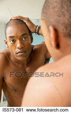 Stock Photography - man looking in 
mirror. fotosearch 
- search stock 
photos, pictures, 
images, and photo 
clipart