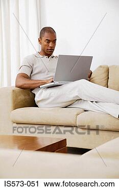 Stock Photography - man using laptop 
computer. fotosearch 
- search stock 
photos, pictures, 
images, and photo 
clipart
