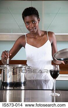 Stock Photo - woman cooking 
in kitchen. fotosearch 
- search stock 
photos, pictures, 
images, and photo 
clipart
