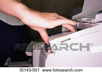 Stock Photography - woman fits colour 
cartridge. fotosearch 
- search stock 
photos, pictures, 
images, and photo 
clipart