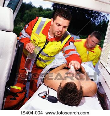Stock Photo - ambulance staff 
with patient. 
fotosearch - search 
stock photos, 
pictures, images, 
and photo clipart