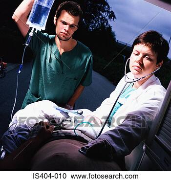 Stock Photography - ambulance staff 
with patient. 
fotosearch - search 
stock photos, 
pictures, images, 
and photo clipart