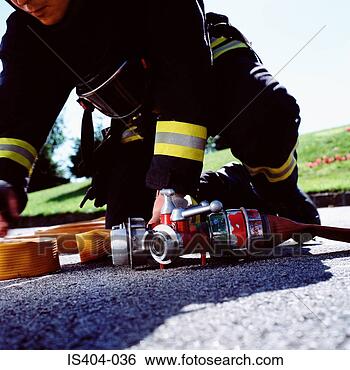 Stock Photo - fireman connecting 
hoses. fotosearch 
- search stock 
photos, pictures, 
images, and photo 
clipart