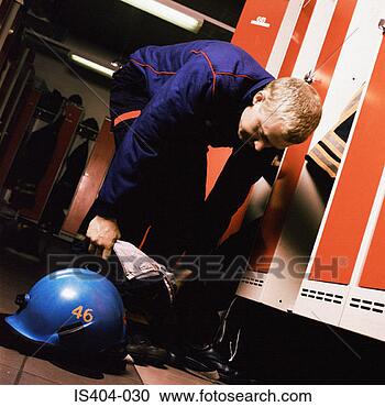 Stock Photography - fireman getting 
ready to leave. 
fotosearch - search 
stock photos, 
pictures, images, 
and photo clipart