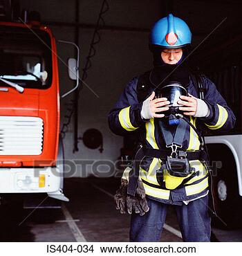 Stock Photo - fireman getting 
ready to leave. 
fotosearch - search 
stock photos, 
pictures, images, 
and photo clipart