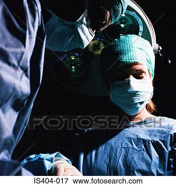 Picture - surgical team 
with patient. 
fotosearch - search 
stock photos, 
pictures, images, 
and photo clipart