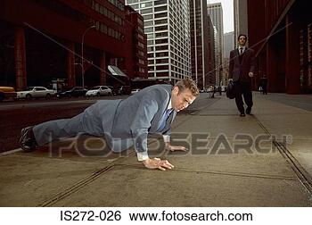 Stock Photo - businessman doing 
push ups in street. 
fotosearch - search 
stock photos, 
pictures, images, 
and photo clipart