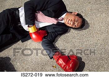 Stock Photograph - businessman unconscious 
on floor. fotosearch 
- search stock 
photos, pictures, 
images, and photo 
clipart