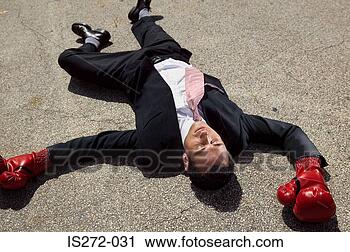 Stock Photography - businessman unconscious 
on floor. fotosearch 
- search stock 
photos, pictures, 
images, and photo 
clipart