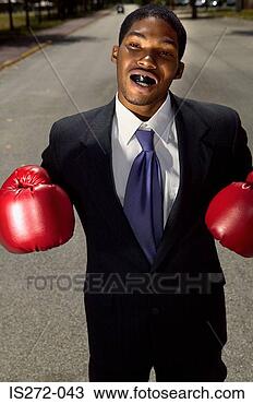 Stock Photo - businessman wearing 
boxing gloves. 
fotosearch - search 
stock photos, 
pictures, images, 
and photo clipart