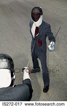Picture - businessmen fencing. 
fotosearch - search 
stock photos, 
pictures, images, 
and photo clipart