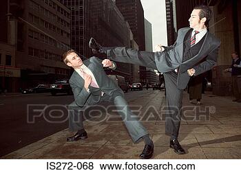 Stock Photo - businessmen fighting 
in street. fotosearch 
- search stock 
photos, pictures, 
images, and photo 
clipart