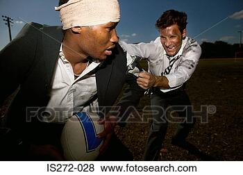 Stock Photo - businessmen playing 
rugby. fotosearch 
- search stock 
photos, pictures, 
images, and photo 
clipart