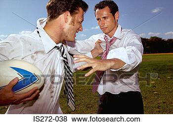 Stock Photo - businessmen playing 
rugby. fotosearch 
- search stock 
photos, pictures, 
images, and photo 
clipart