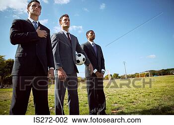 Stock Photo - businessmen standing 
in row in field. 
fotosearch - search 
stock photos, 
pictures, images, 
and photo clipart