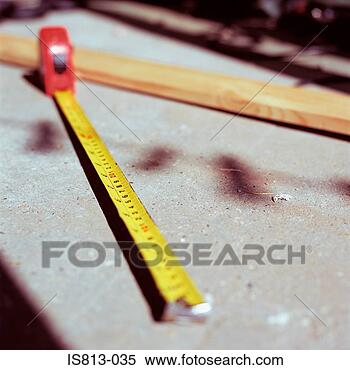 Stock Image - tape measure and 
timber. fotosearch 
- search stock 
photos, pictures, 
images, and photo 
clipart