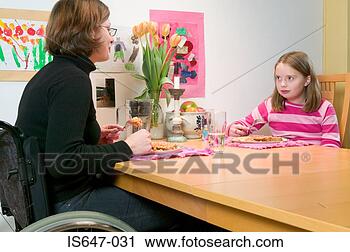 Stock Photography - mother and daughter 
eating beans on 
toast. fotosearch 
- search stock 
photos, pictures, 
images, and photo 
clipart