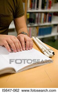 Stock Photo - young man reading 
braille. fotosearch 
- search stock 
photos, pictures, 
images, and photo 
clipart