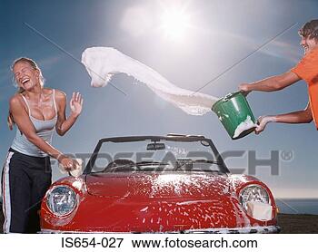 Picture - boy throwing soapy 
water at girl. 
fotosearch - search 
stock photos, 
pictures, images, 
and photo clipart