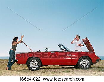 Stock Photo - couple having 
car trouble. fotosearch 
- search stock 
photos, pictures, 
images, and photo 
clipart