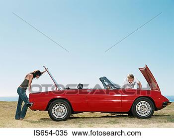 Stock Image - couple having 
car trouble. fotosearch 
- search stock 
photos, pictures, 
images, and photo 
clipart
