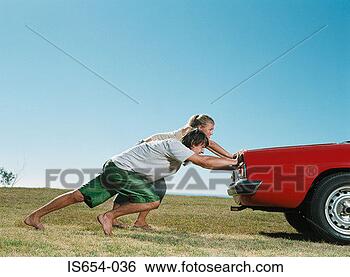 Stock Photo - couple pushing 
car. fotosearch 
- search stock 
photos, pictures, 
images, and photo 
clipart