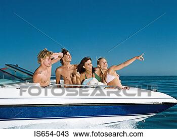 Stock Photo - friends on a speedboat. 
fotosearch - search 
stock photos, 
pictures, images, 
and photo clipart