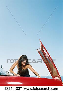 Picture - woman repairing 
car engine. fotosearch 
- search stock 
photos, pictures, 
images, and photo 
clipart