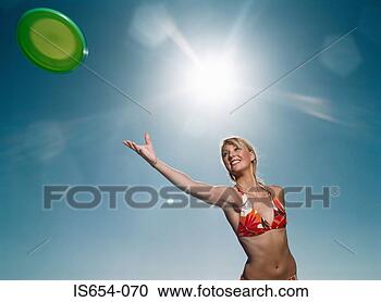 Stock Photography - woman throwing 
flying disc. fotosearch 
- search stock 
photos, pictures, 
images, and photo 
clipart
