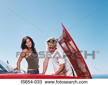 Stock Photo - young couple looking 
at car engine. 
fotosearch - search 
stock photos, 
pictures, images, 
and photo clipart