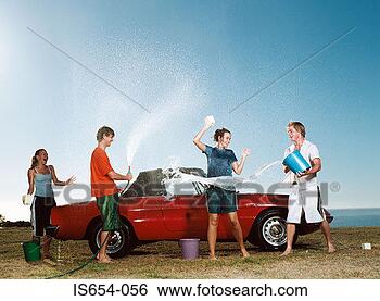 Stock Photo - young people having 
water fight and 
washing car. fotosearch 
- search stock 
photos, pictures, 
images, and photo 
clipart