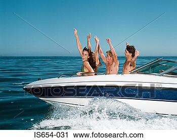 Stock Photography - young people on 
speedboat. fotosearch 
- search stock 
photos, pictures, 
images, and photo 
clipart