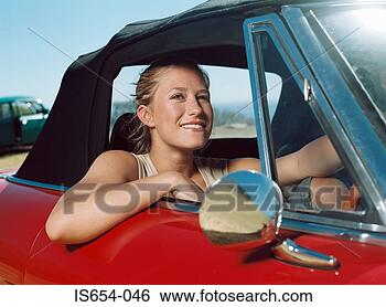Stock Photo - young woman in 
a red car. fotosearch 
- search stock 
photos, pictures, 
images, and photo 
clipart