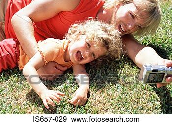 Stock Photograph - father and daughter 
taking photographs. 
fotosearch - search 
stock photos, 
pictures, images, 
and photo clipart