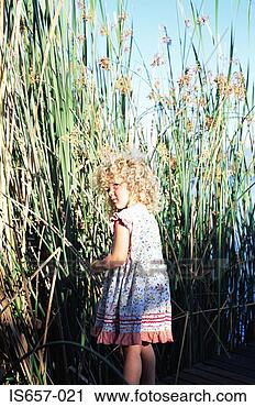 Stock Photography - girl by reeds. 
fotosearch - search 
stock photos, 
pictures, images, 
and photo clipart