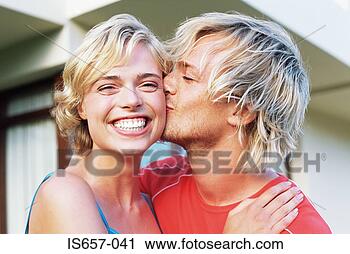 Stock Photography - man kissing wife 
on the cheek. 
fotosearch - search 
stock photos, 
pictures, images, 
and photo clipart