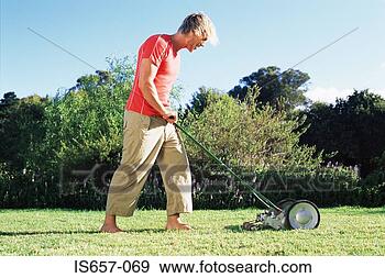 Stock Photograph - man mowing lawn. 
fotosearch - search 
stock photos, 
pictures, images, 
and photo clipart
