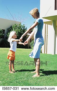 Stock Photography - mother and daughter 
in garden. fotosearch 
- search stock 
photos, pictures, 
images, and photo 
clipart