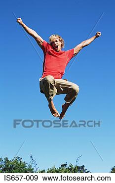 Stock Photograph - young man jumping. 
fotosearch - search 
stock photos, 
pictures, images, 
and photo clipart