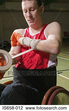Stock Photo - basketball player 
bandaging his 
arm. fotosearch 
- search stock 
photos, pictures, 
images, and photo 
clipart