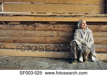 Stock Image - senior woman crouching. 
fotosearch - search 
stock photos, 
pictures, images, 
and photo clipart