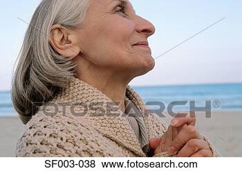 Stock Photo - senior woman looking 
spiritual. fotosearch 
- search stock 
photos, pictures, 
images, and photo 
clipart