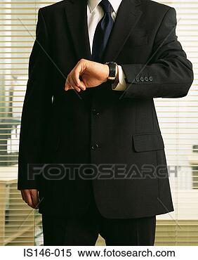 Stock Image - businessman looking 
at watch. fotosearch 
- search stock 
photos, pictures, 
images, and photo 
clipart