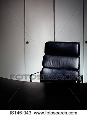 Stock Photo - office chair and 
empty desk. fotosearch 
- search stock 
photos, pictures, 
images, and photo 
clipart