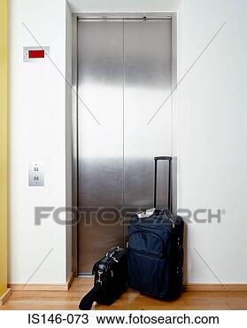 Stock Photo - suitcase outside 
elevator. fotosearch 
- search stock 
photos, pictures, 
images, and photo 
clipart