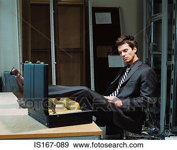 Stock Photograph - businessman looking 
at briefcase of 
gold bars. fotosearch 
- search stock 
photos, pictures, 
images, and photo 
clipart
