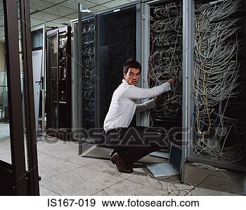 Stock Photograph - man adjusting 
electrical cables. 
fotosearch - search 
stock photos, 
pictures, images, 
and photo clipart