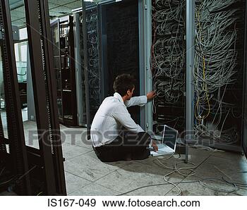 Stock Photograph - man adjusting 
electrical cables. 
fotosearch - search 
stock photos, 
pictures, images, 
and photo clipart