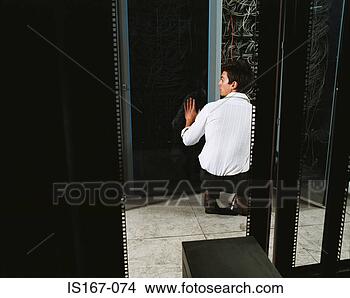 Stock Photo - man adjusting 
electrical cables. 
fotosearch - search 
stock photos, 
pictures, images, 
and photo clipart